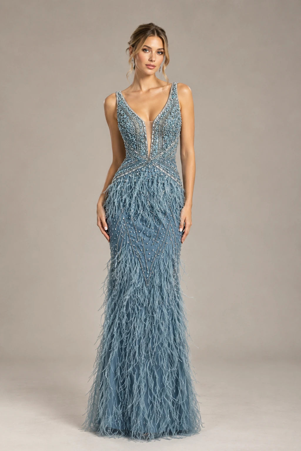 Dusty blue beaded prom dress with V-neck, spaghetti straps, and feather fringe skirt