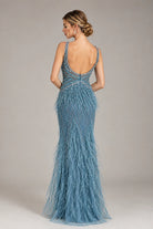 Dusty blue beaded prom dress with V-back, spaghetti straps, and feather fringe hem