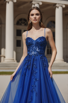 Royal blue tulle A-line gown with sequin bodice.