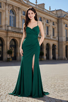 
Emerald green glitter evening gown with ruched bodice and high slit.