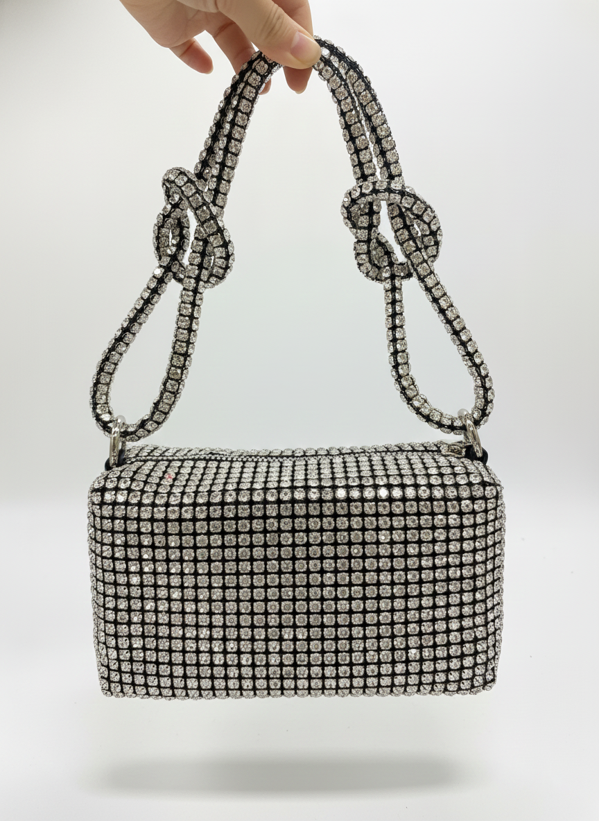 Silver rhinestone mesh shoulder bag with top handles and bow accents