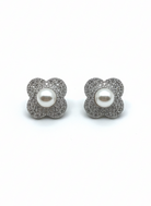 Floral stud earrings with glittery silver petals and a white pearl center