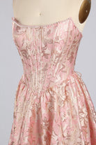 Pink corset-style formal dress with floral print, sweetheart neckline and spaghetti straps