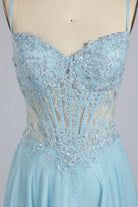 Sky blue plus-size sequin tulle gown with beaded bodice and V-neck straps