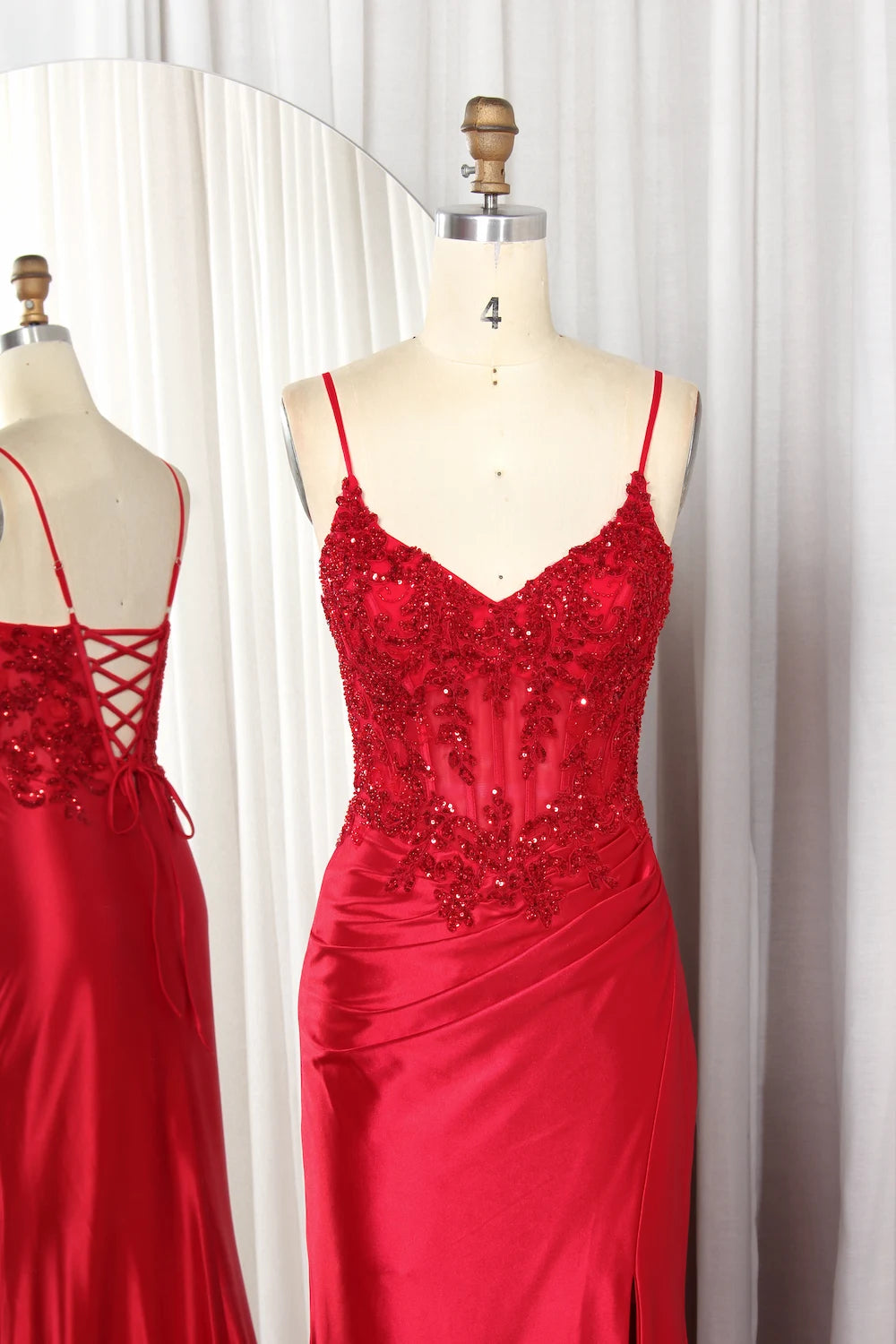 Red sequin fitted gown with spaghetti straps and V-neck