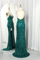 Emerald sequin corset slit gown on mannequins, open back and fitted corset bodice