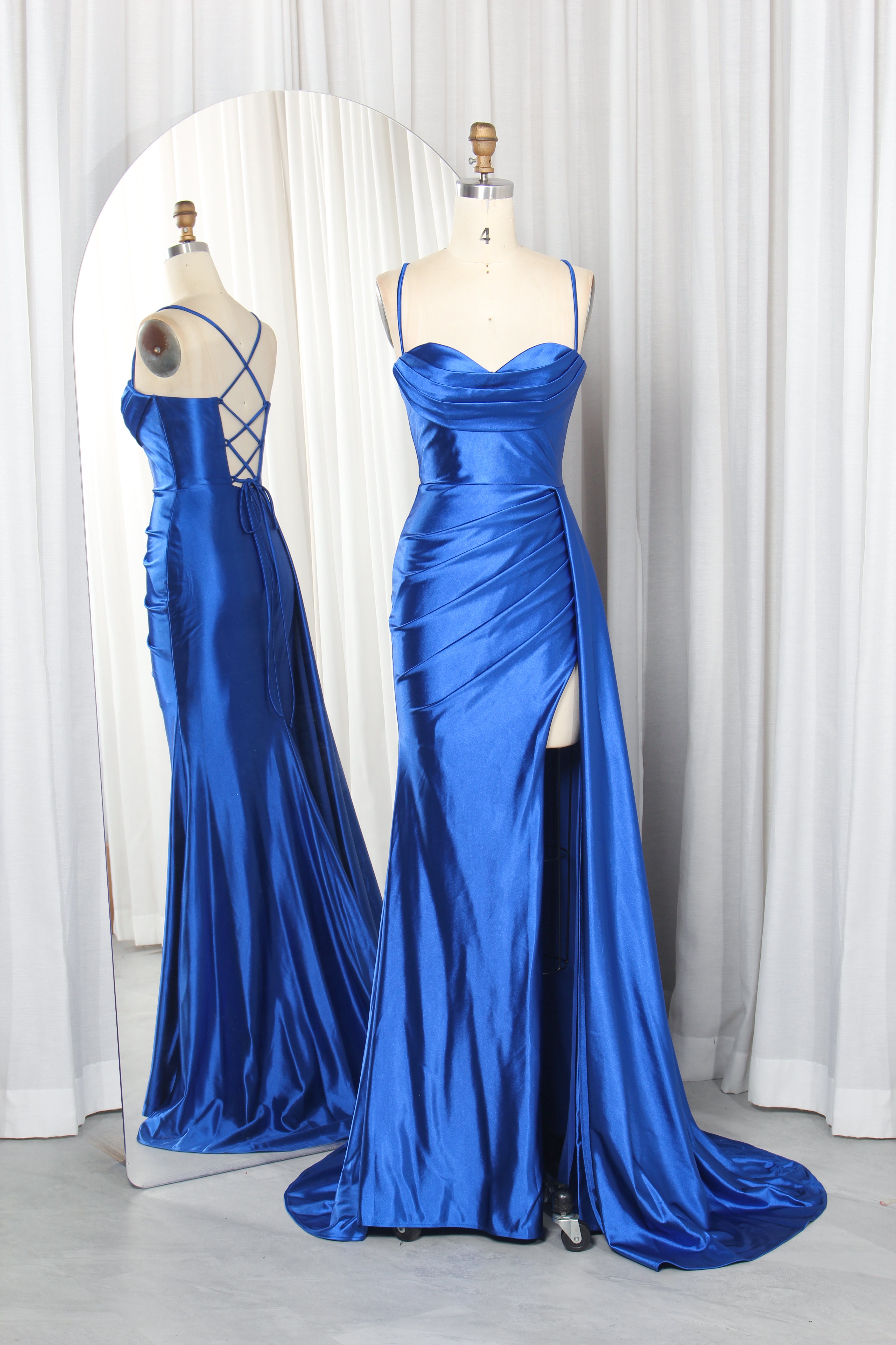 satin prom dress with spaghetti straps, a draped bodice, and a high slit.
