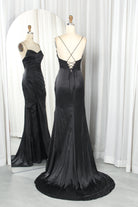 Black satin gown with crisscross lace-up back and flowing front slit