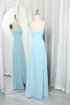Sky blue square-neck chiffon gown with high slit, sleeveless bodice on mannequins
