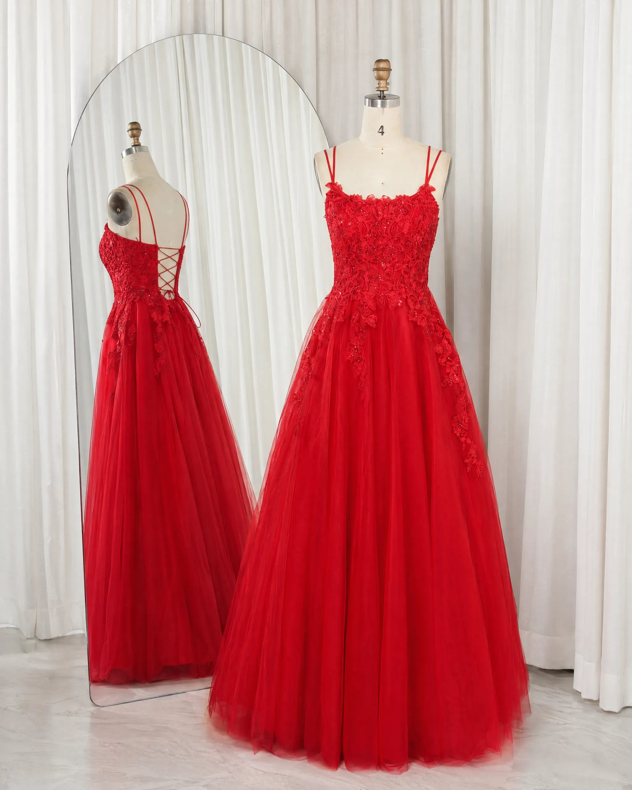 Red A-line prom dress with double spaghetti straps and beaded lace bodice, tulle skirt