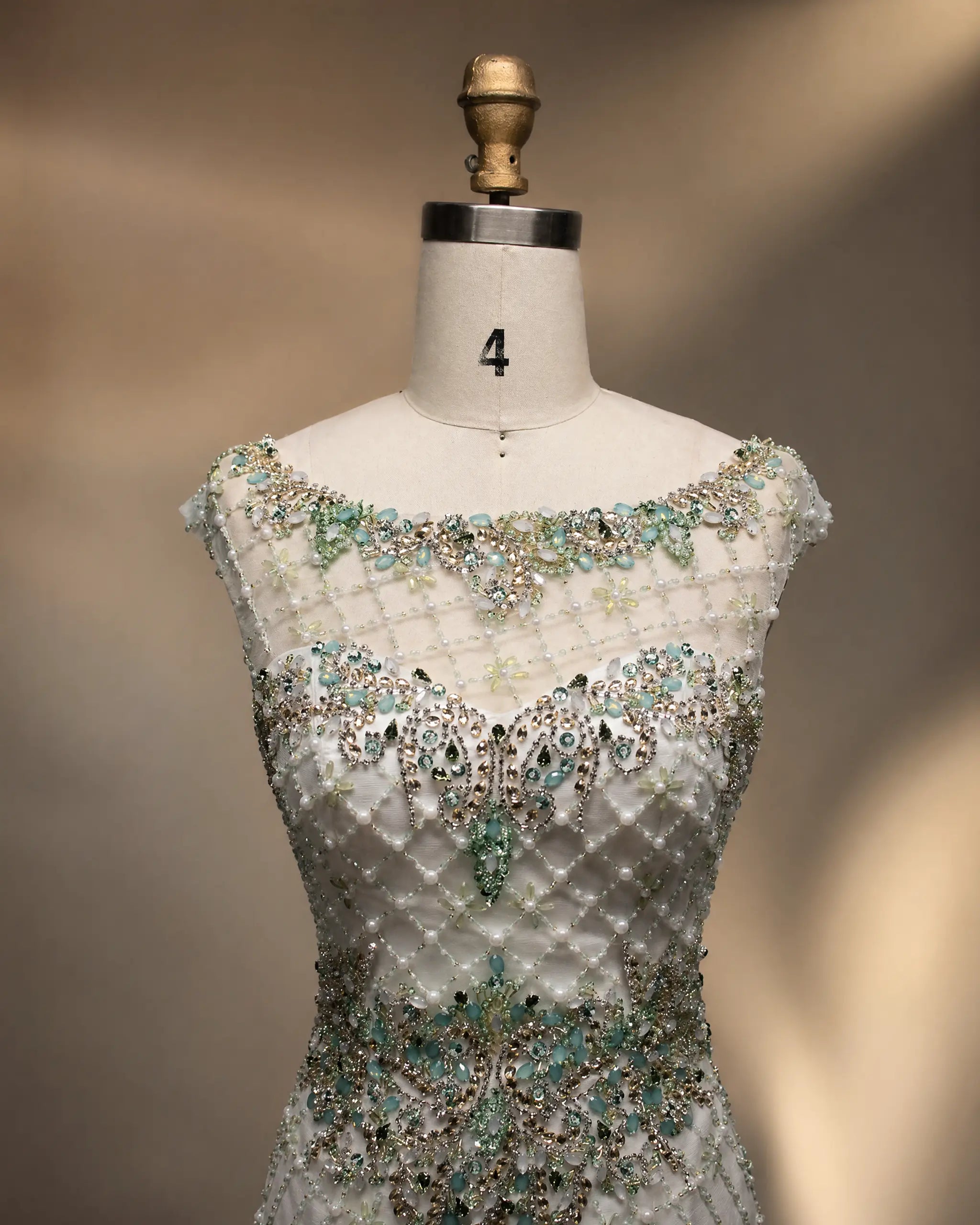 Beaded mermaid dress bodice with sweetheart neckline, teal-and-silver beadwork detail