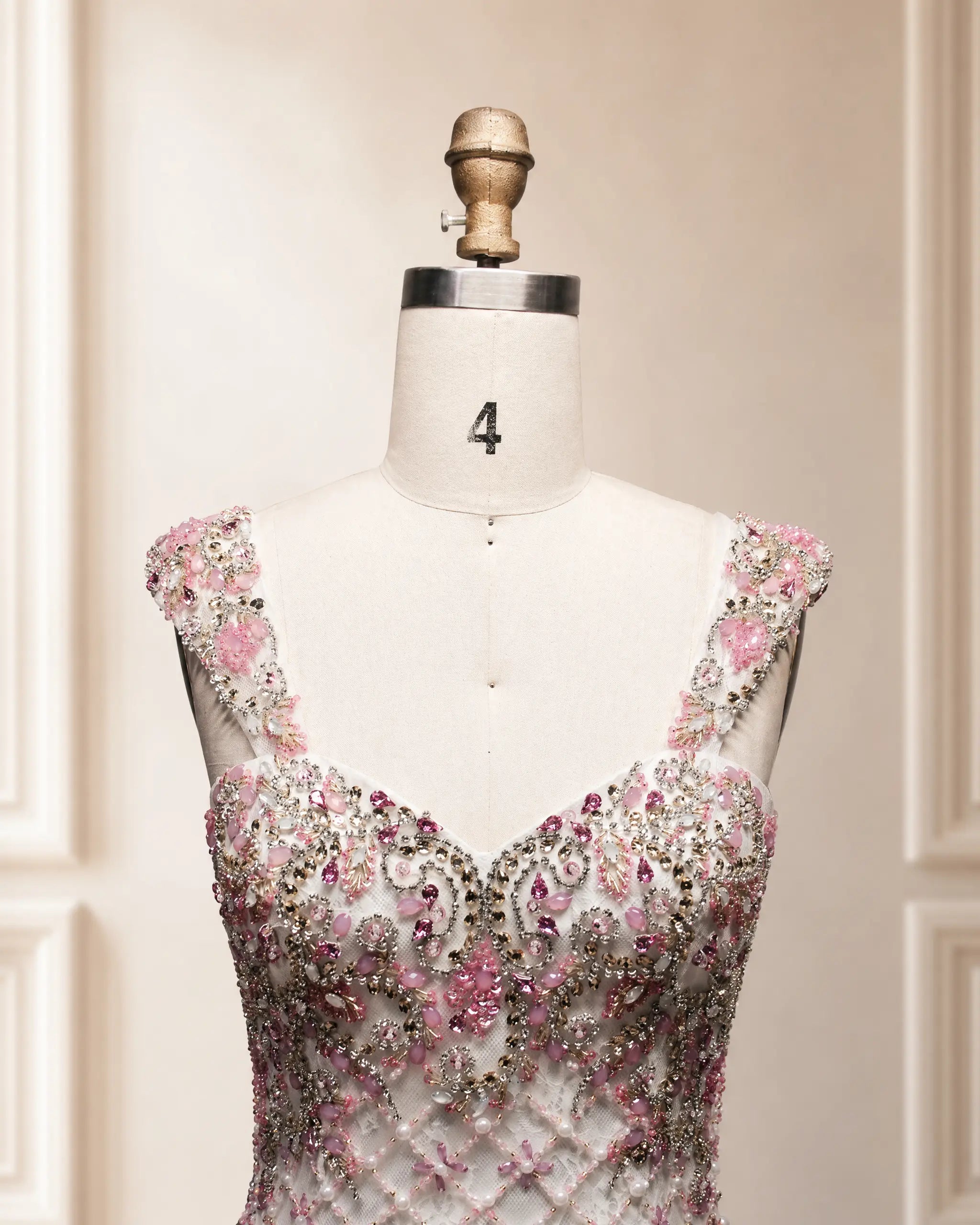 Pink beaded mermaid gown bodice with off-shoulder sleeves and illusion neckline
