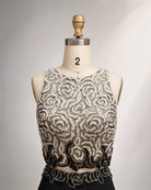 Embroidered chiffon mother-of-the-bride dress bodice with ornate swirls and beaded belt