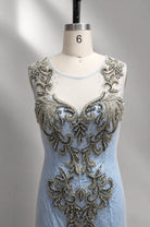 Sky blue lace appliqué illusion neckline bodice with heavy beadwork on mannequin