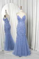Dusty blue sequined mermaid prom dress on mannequins, V-neck and floral tulle skirt